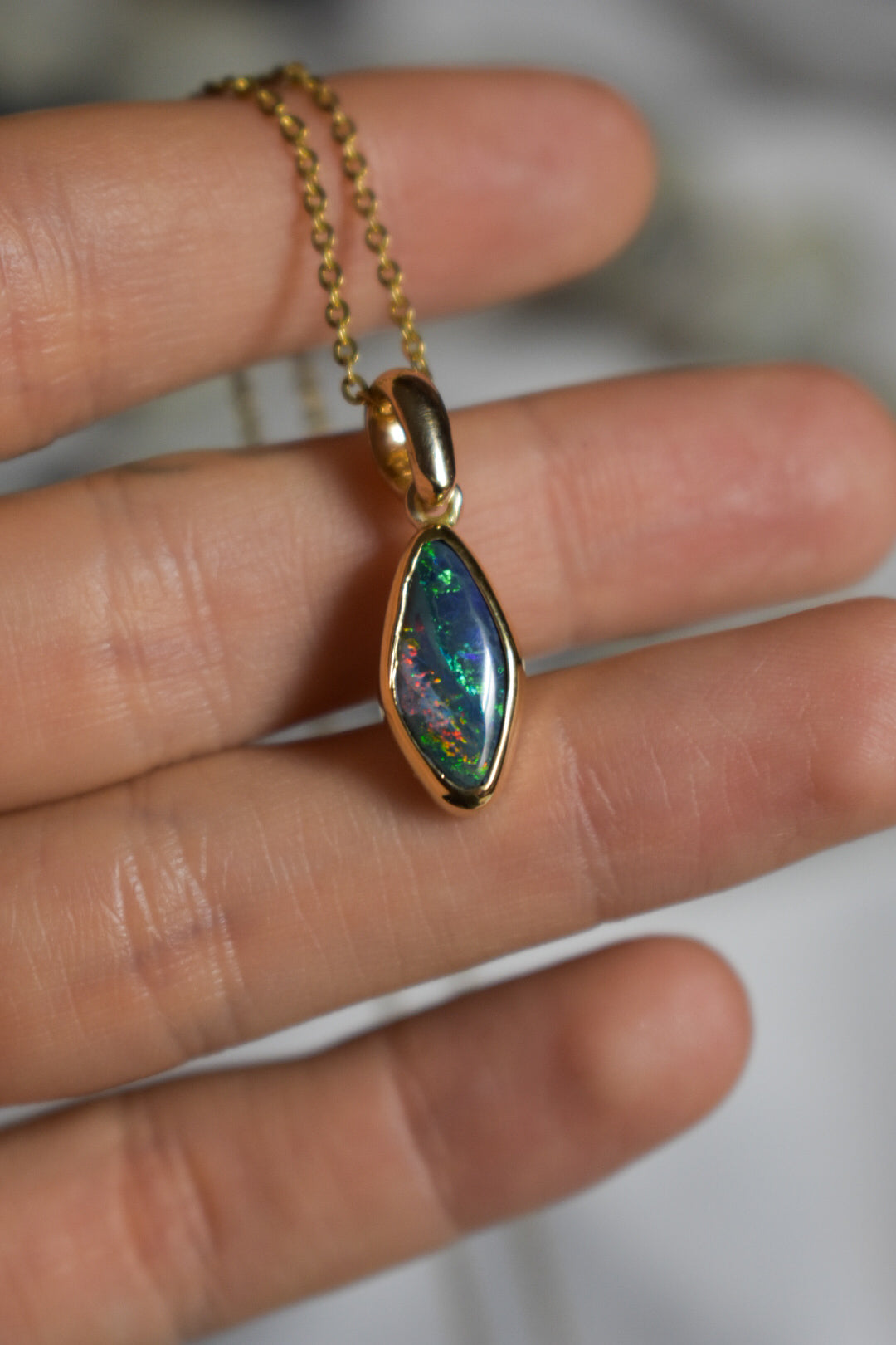 18k solid gold black opal pendant