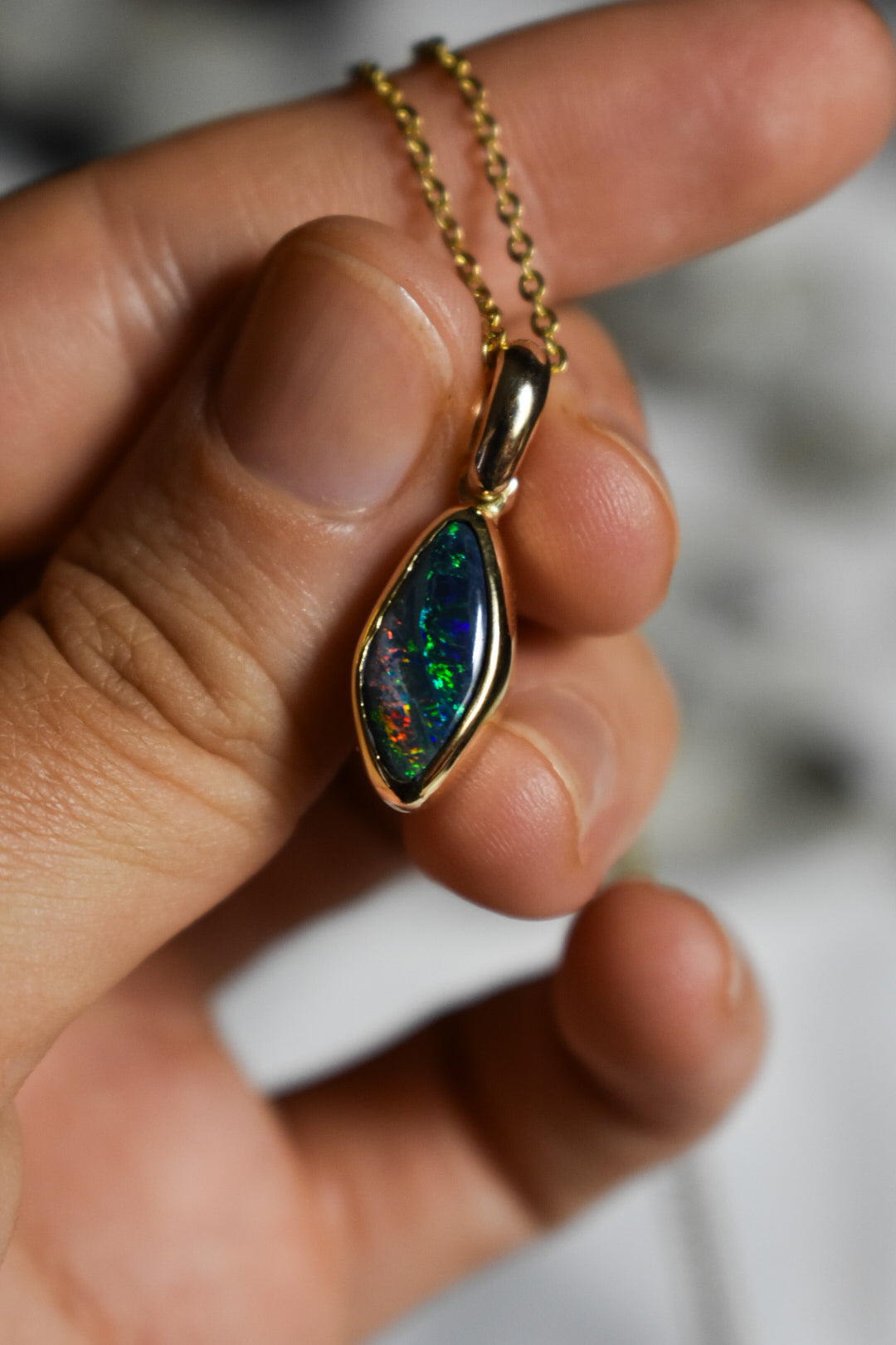 18k solid gold black opal pendant